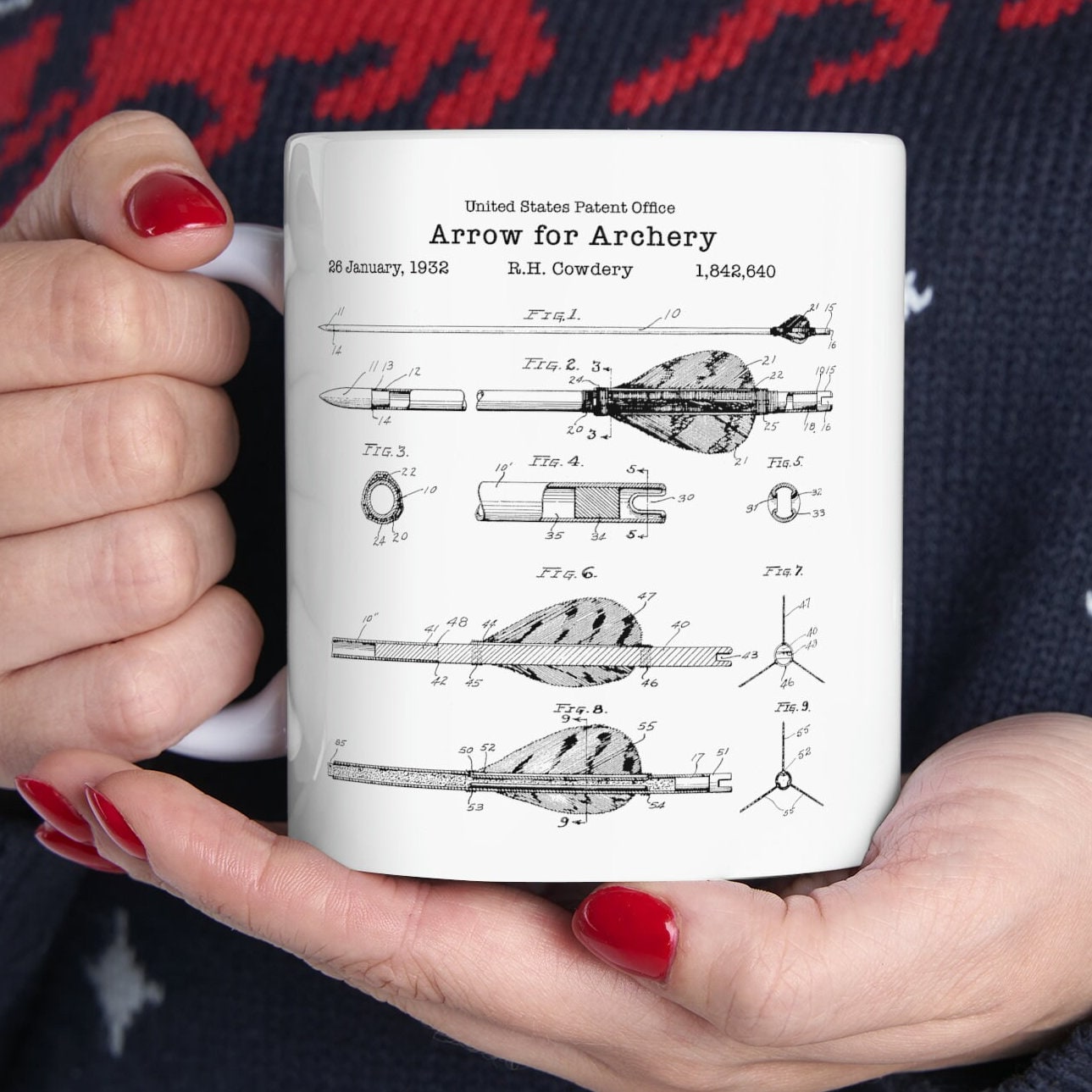 a woman holding a coffee mug in her hands