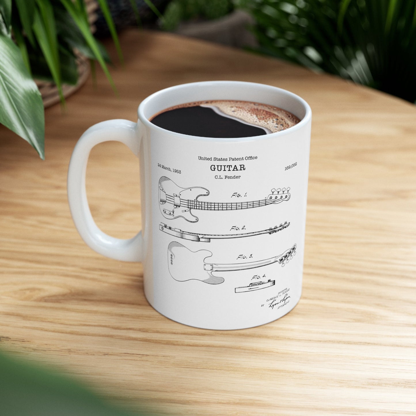 a coffee cup with a drawing of a guitar on it