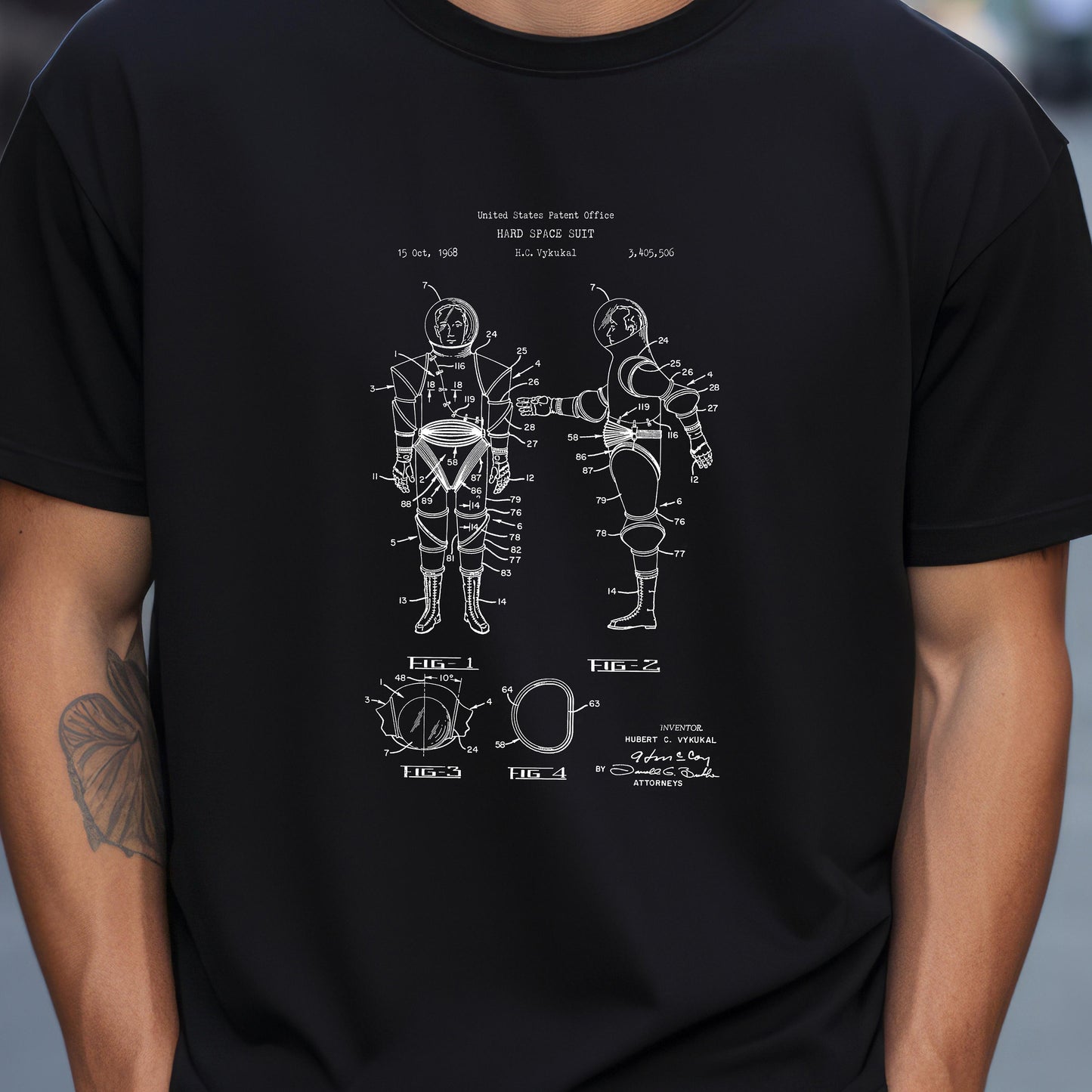 a man wearing a black shirt with a diagram of a human body
