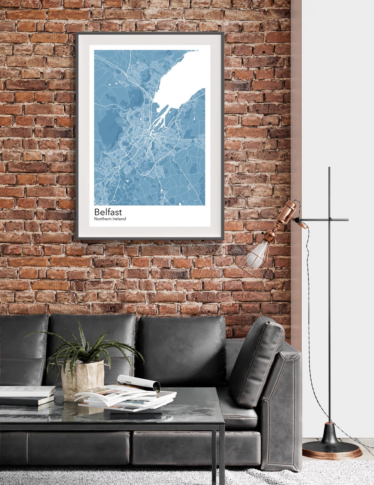 a living room with a couch and a brick wall