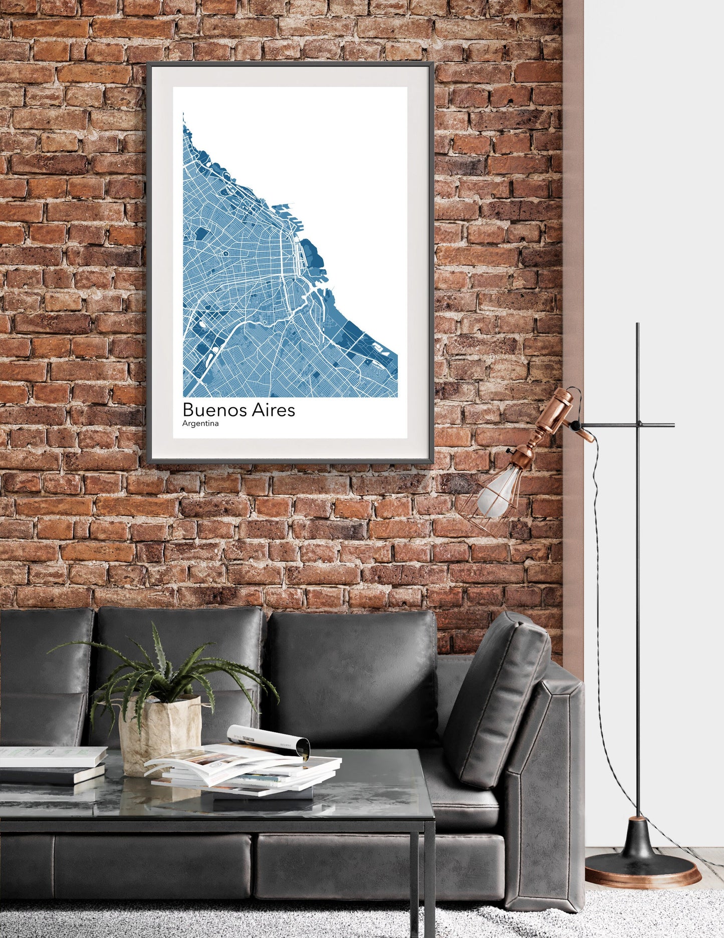 a living room with a couch and a brick wall