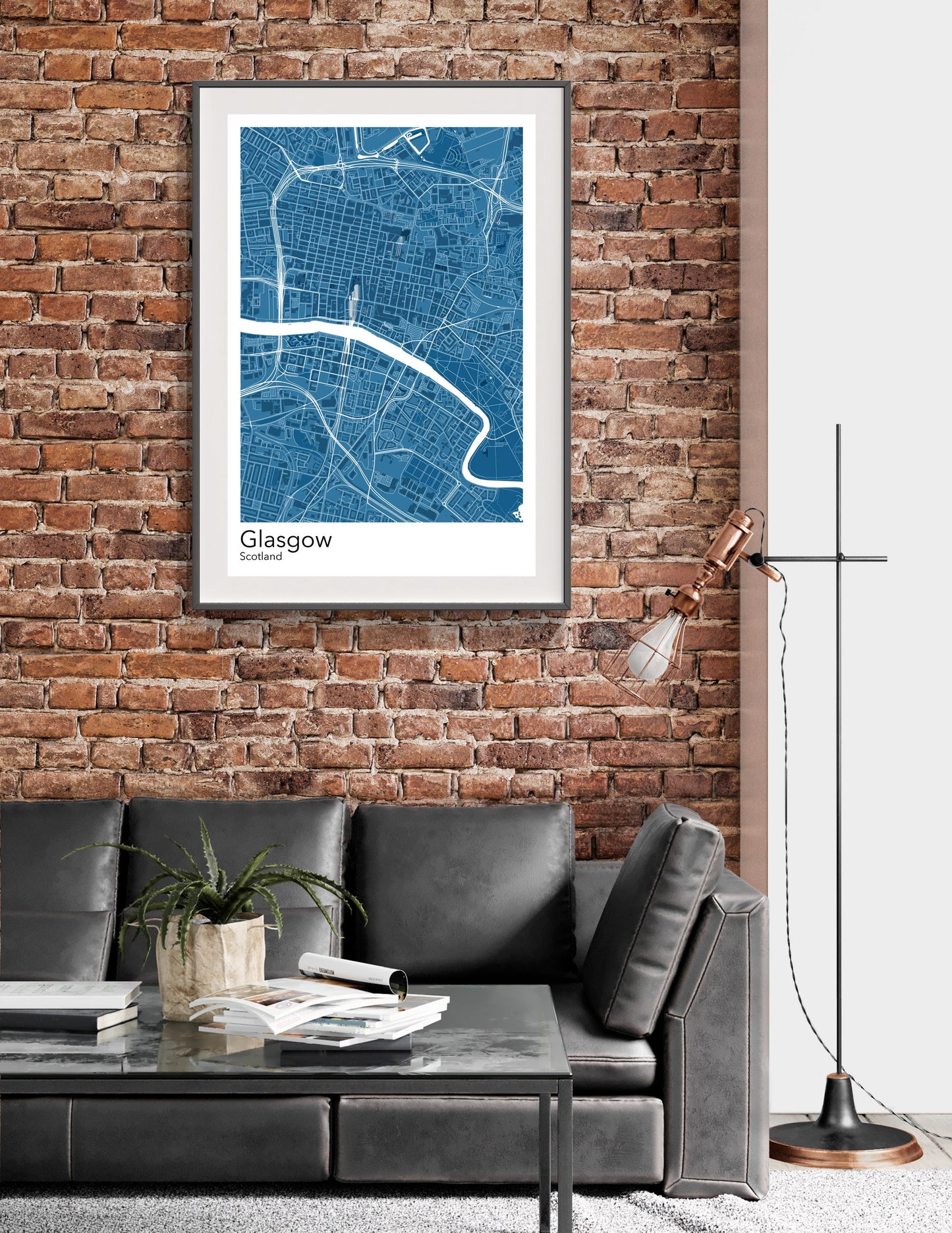 a living room with a couch and a brick wall