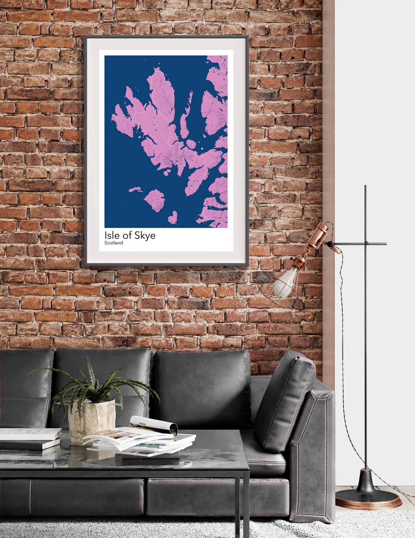 a living room with a couch and a brick wall