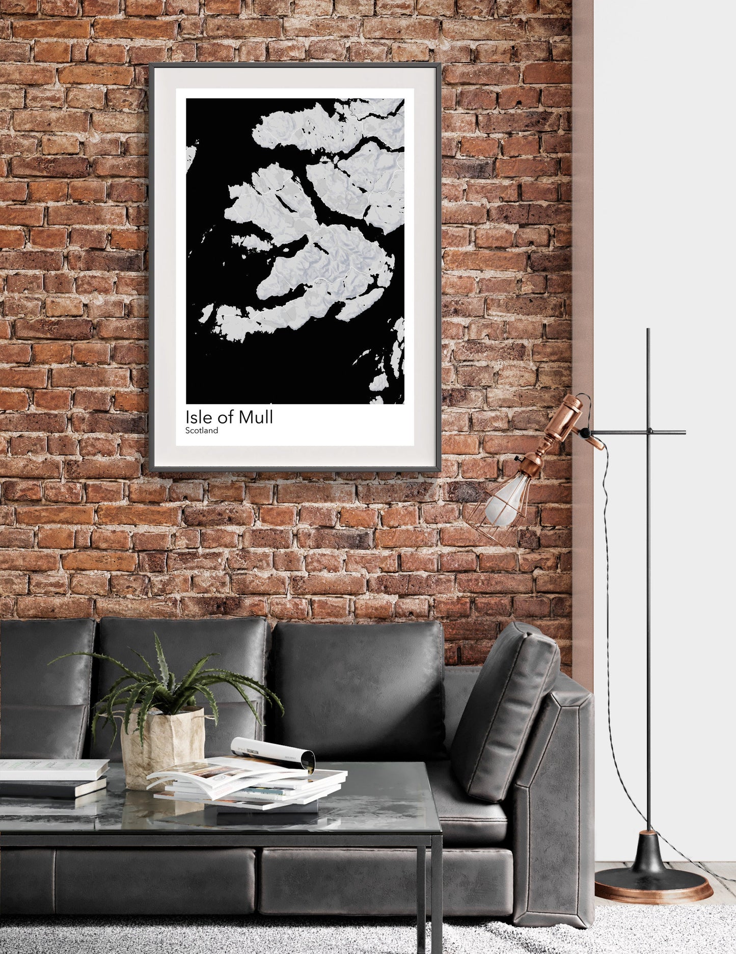 a living room with a couch and a brick wall