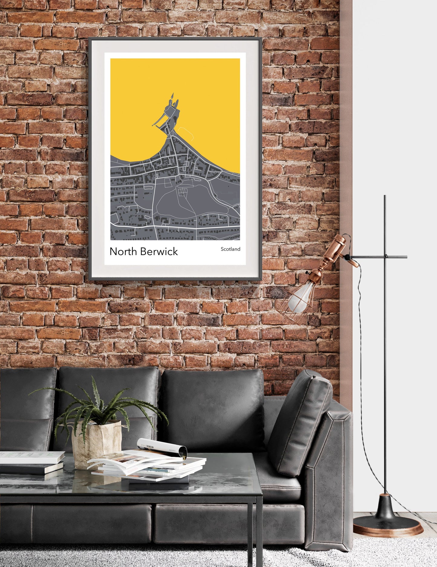 a living room with a couch and a brick wall