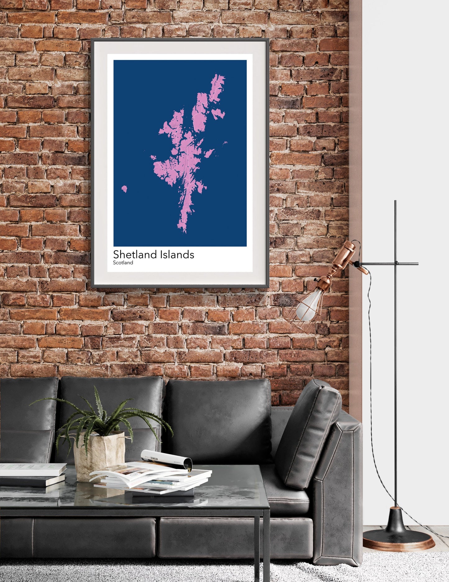 a living room with a couch and a brick wall