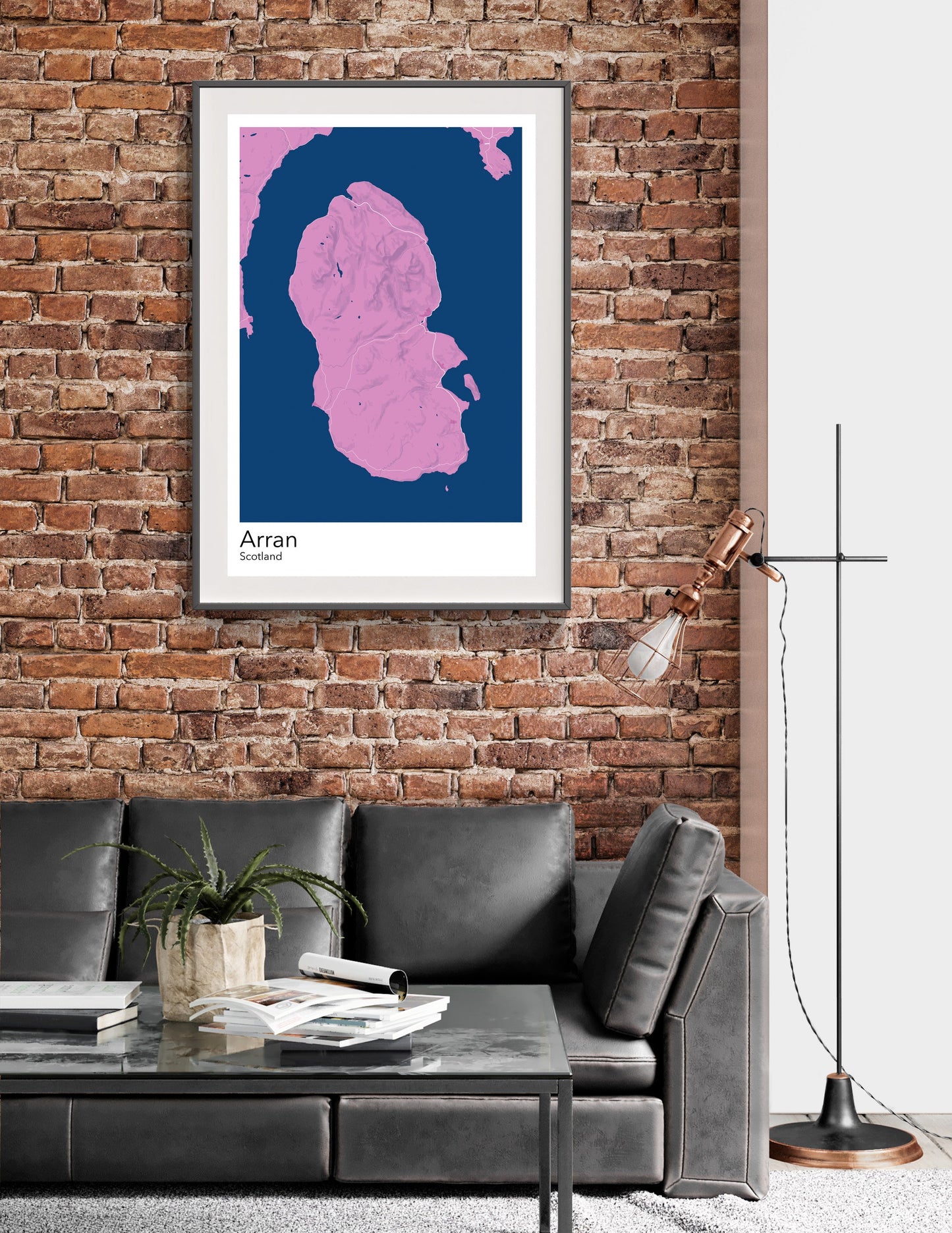 a living room with a couch and a brick wall