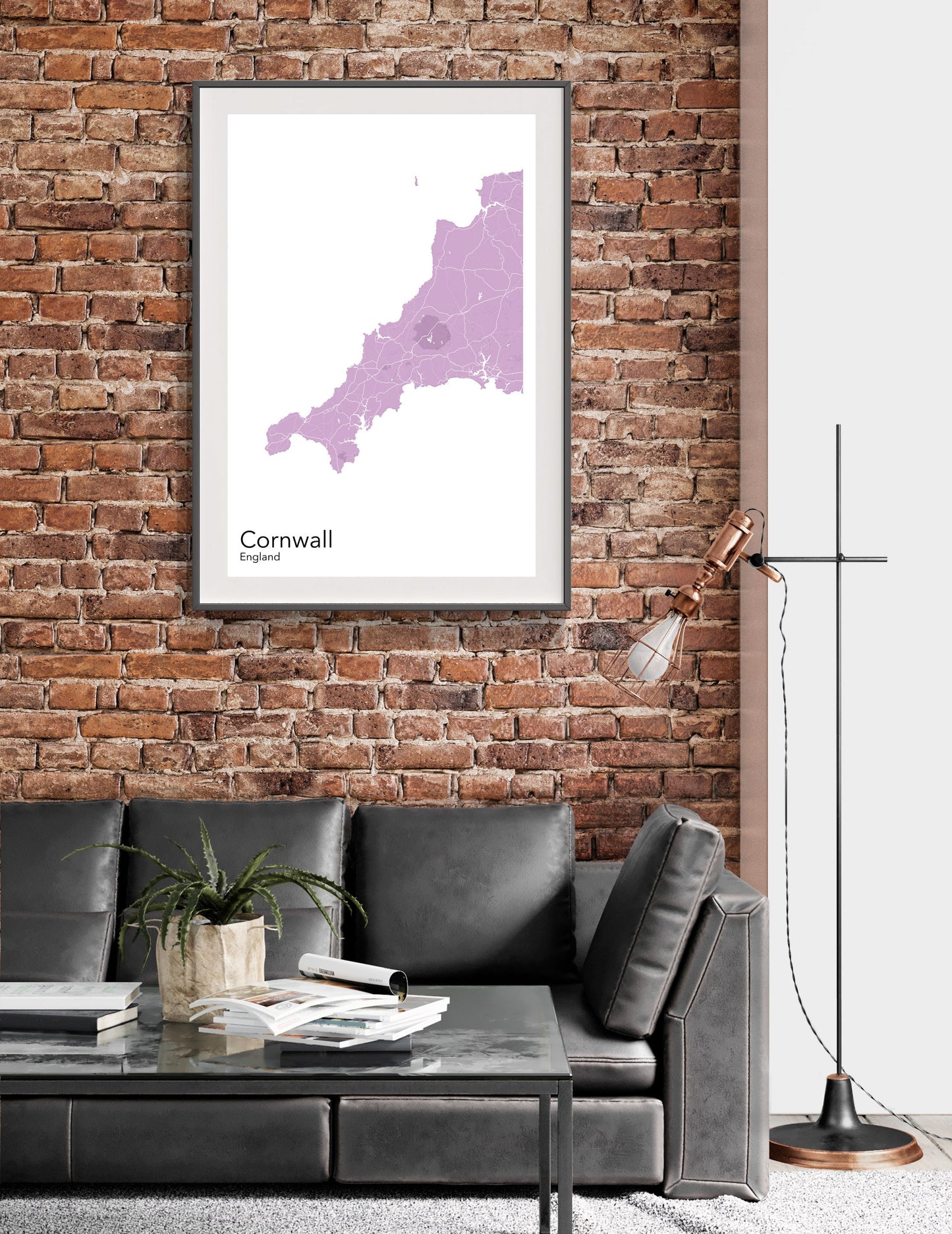 a living room with a couch and a brick wall