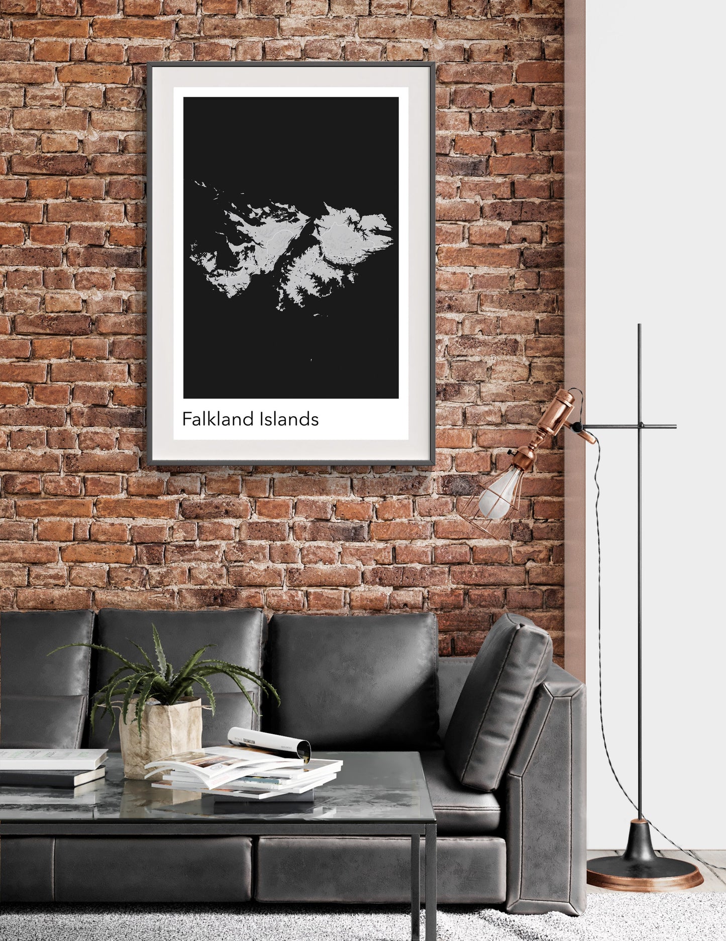 a living room with a couch and a brick wall