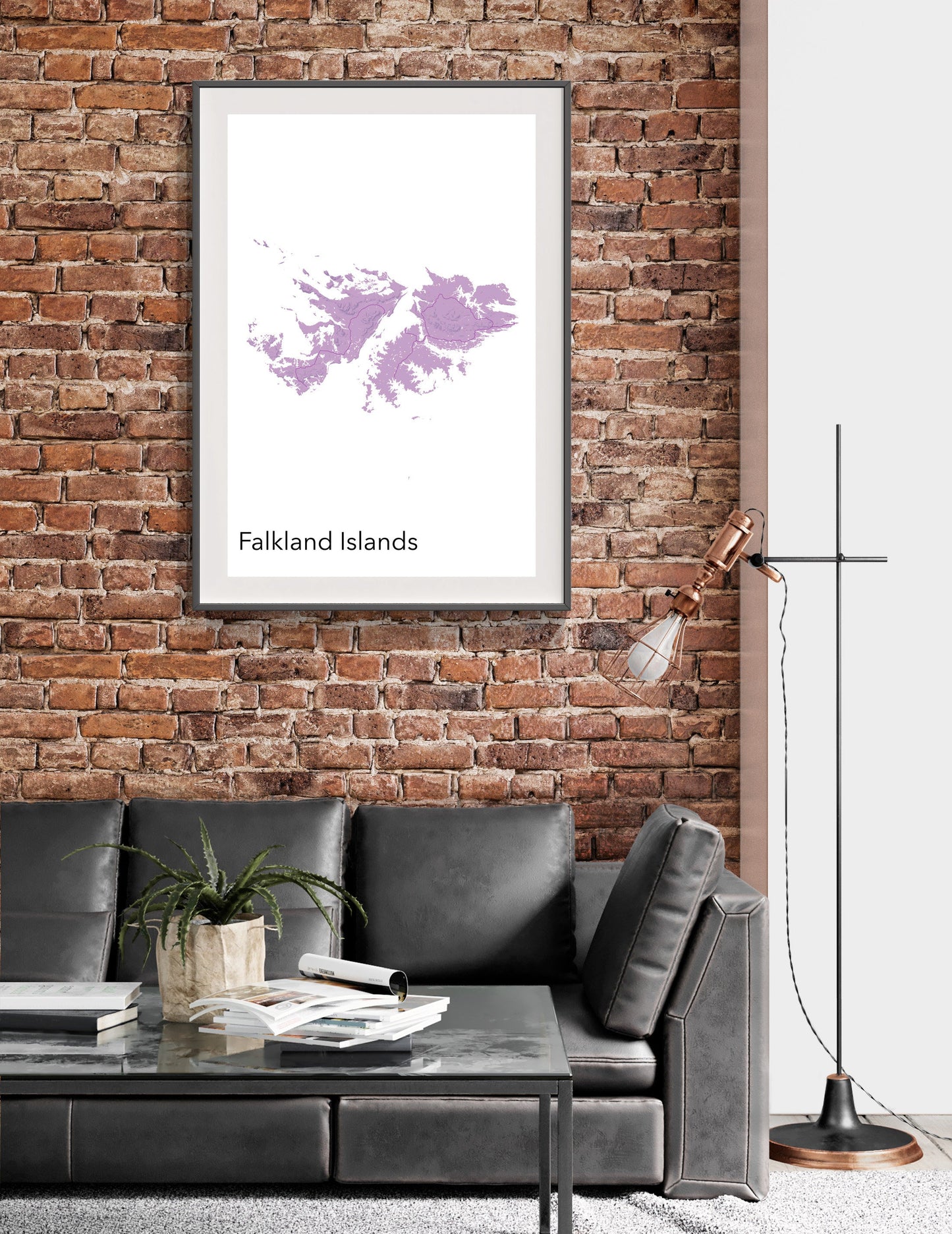 a living room with a couch and a brick wall