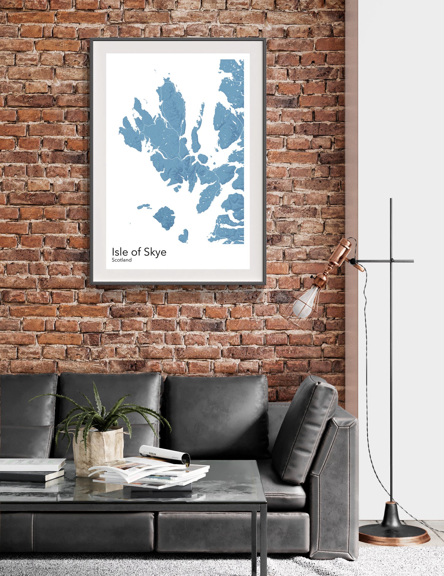 a living room with a couch and a brick wall