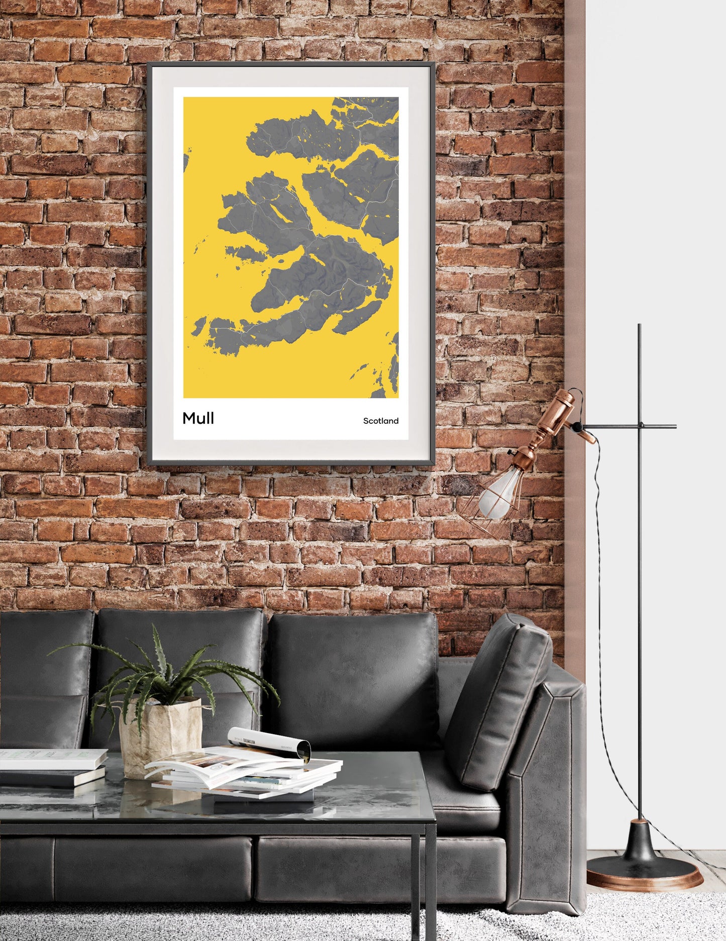 a living room with a couch and a brick wall