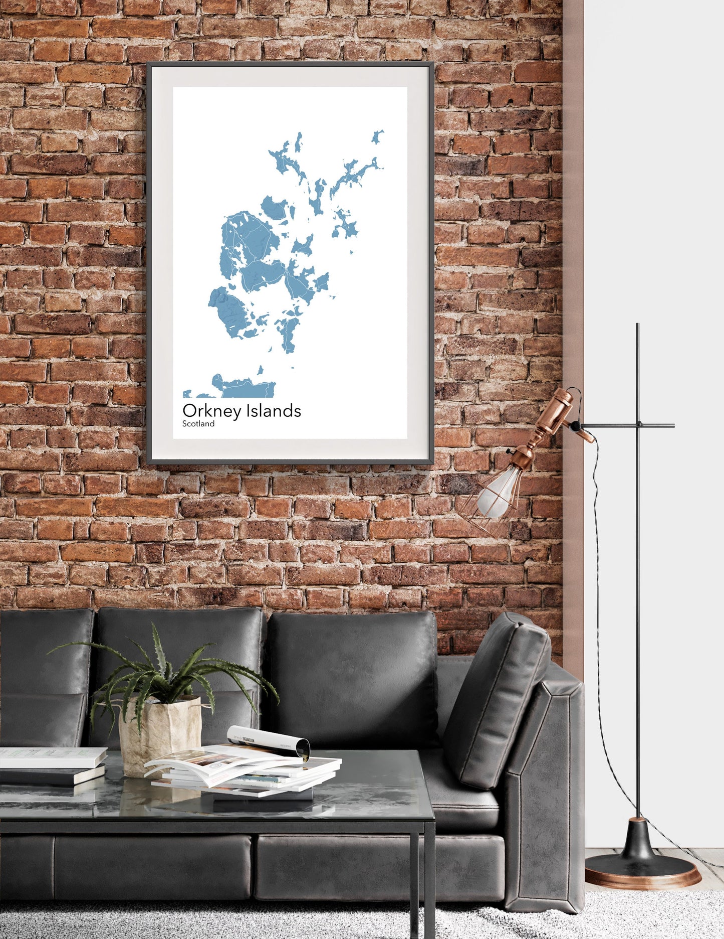 a living room with a couch and a brick wall