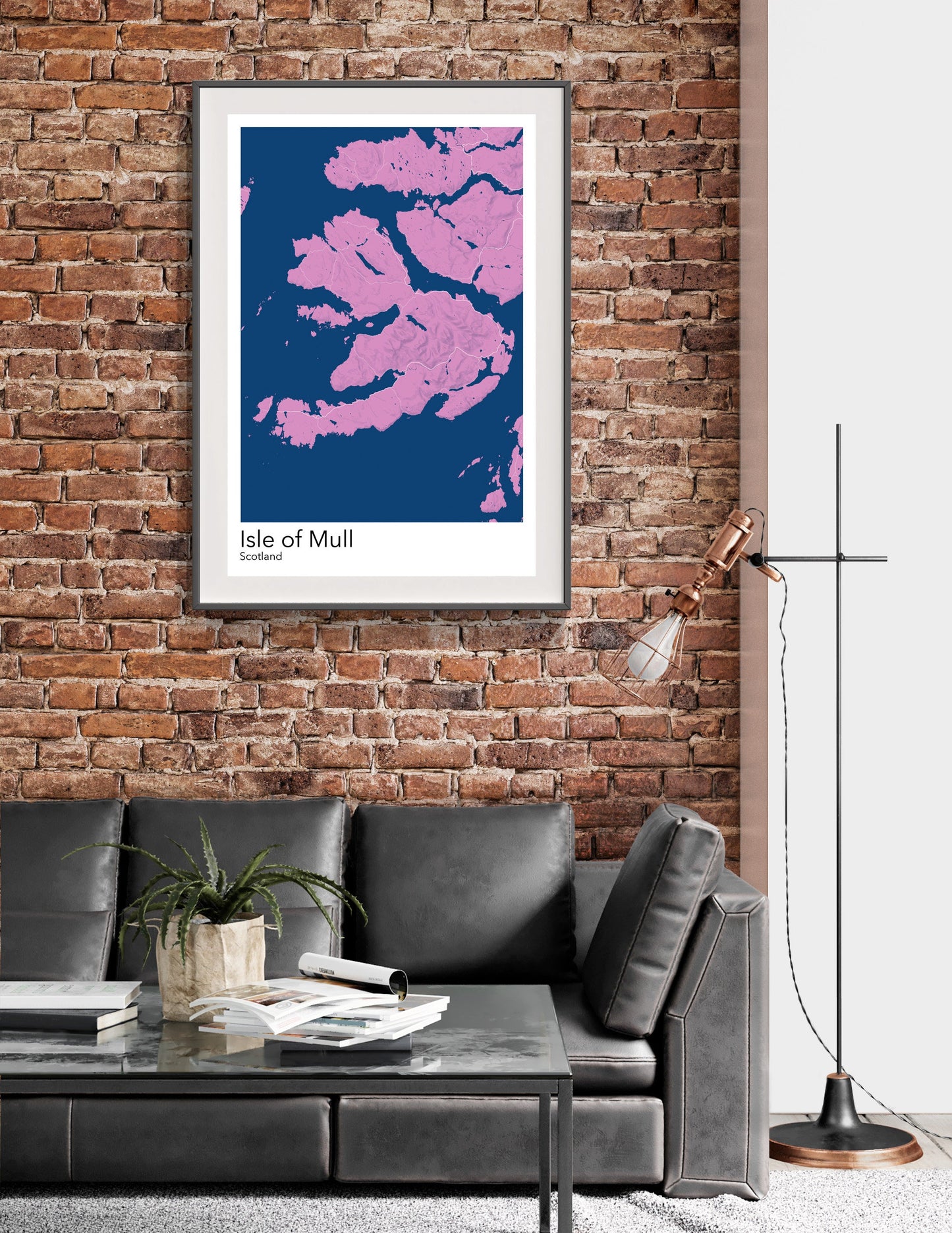 a living room with a couch and a brick wall