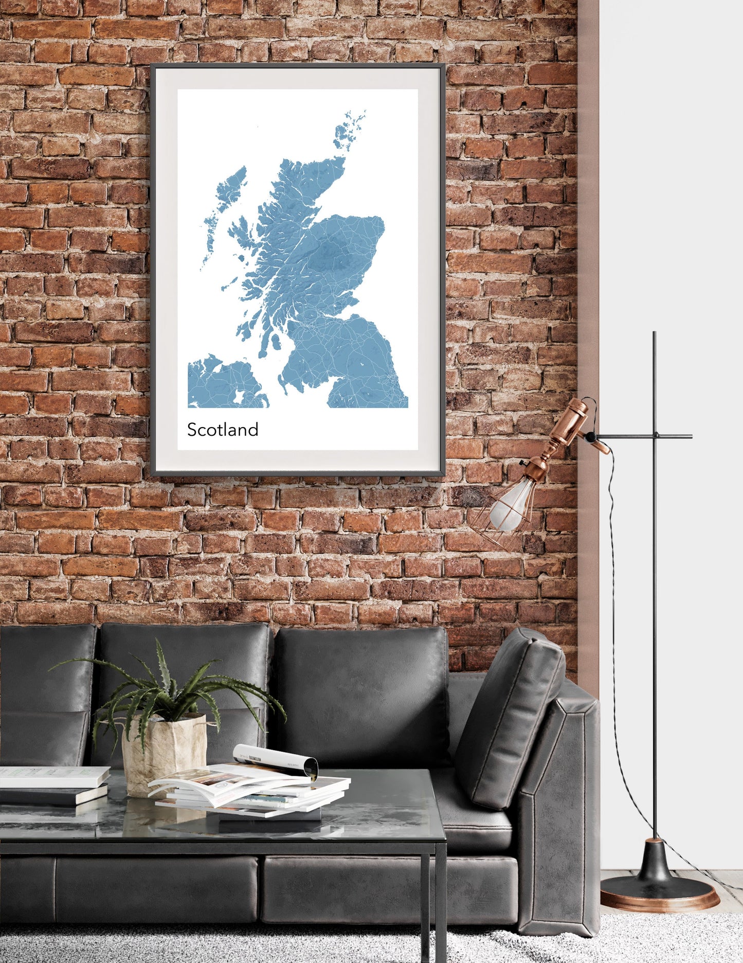 a living room with a couch and a brick wall