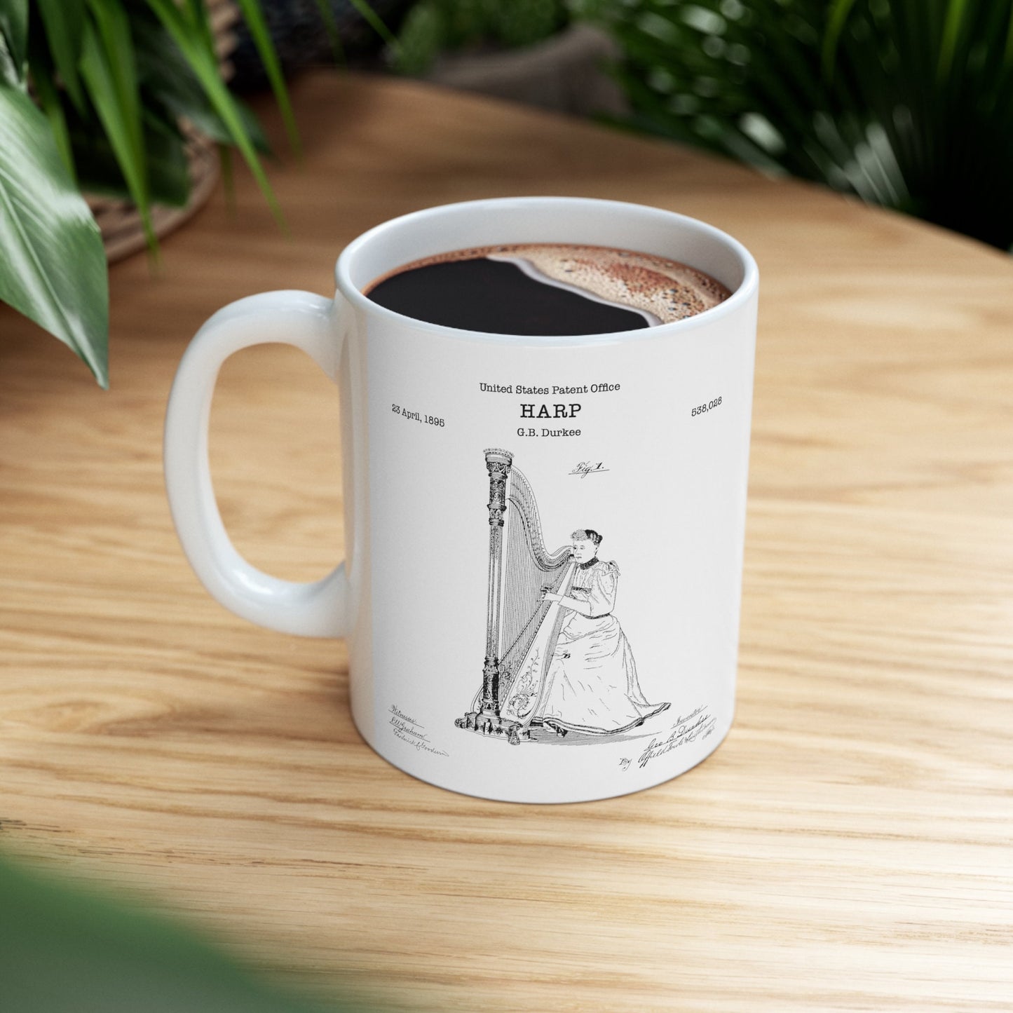 a coffee cup with a drawing of a harp on it