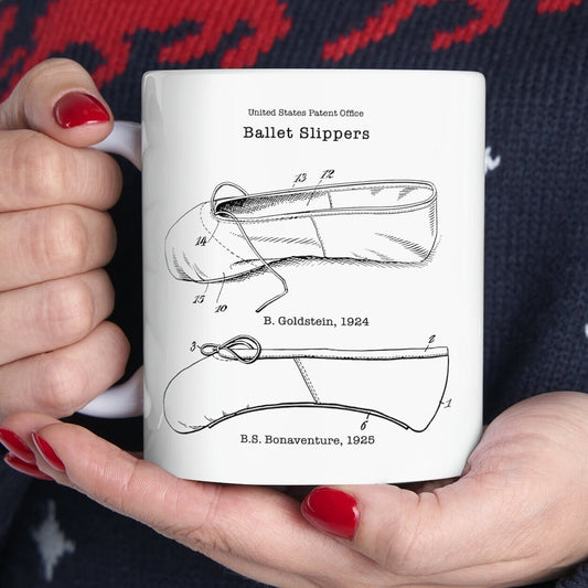 a woman holding a white coffee mug with a diagram of a vehicle