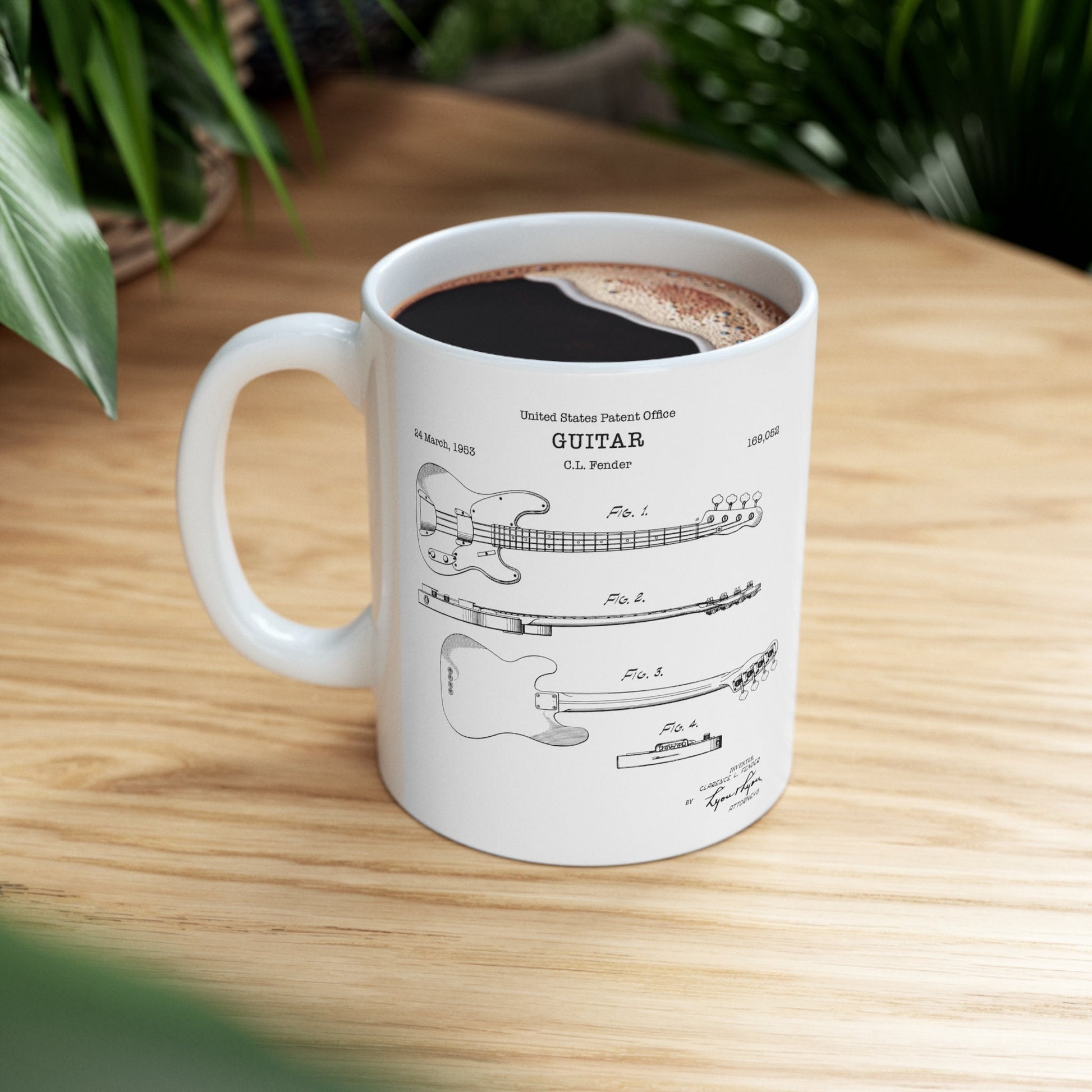a coffee cup with a drawing of a guitar on it