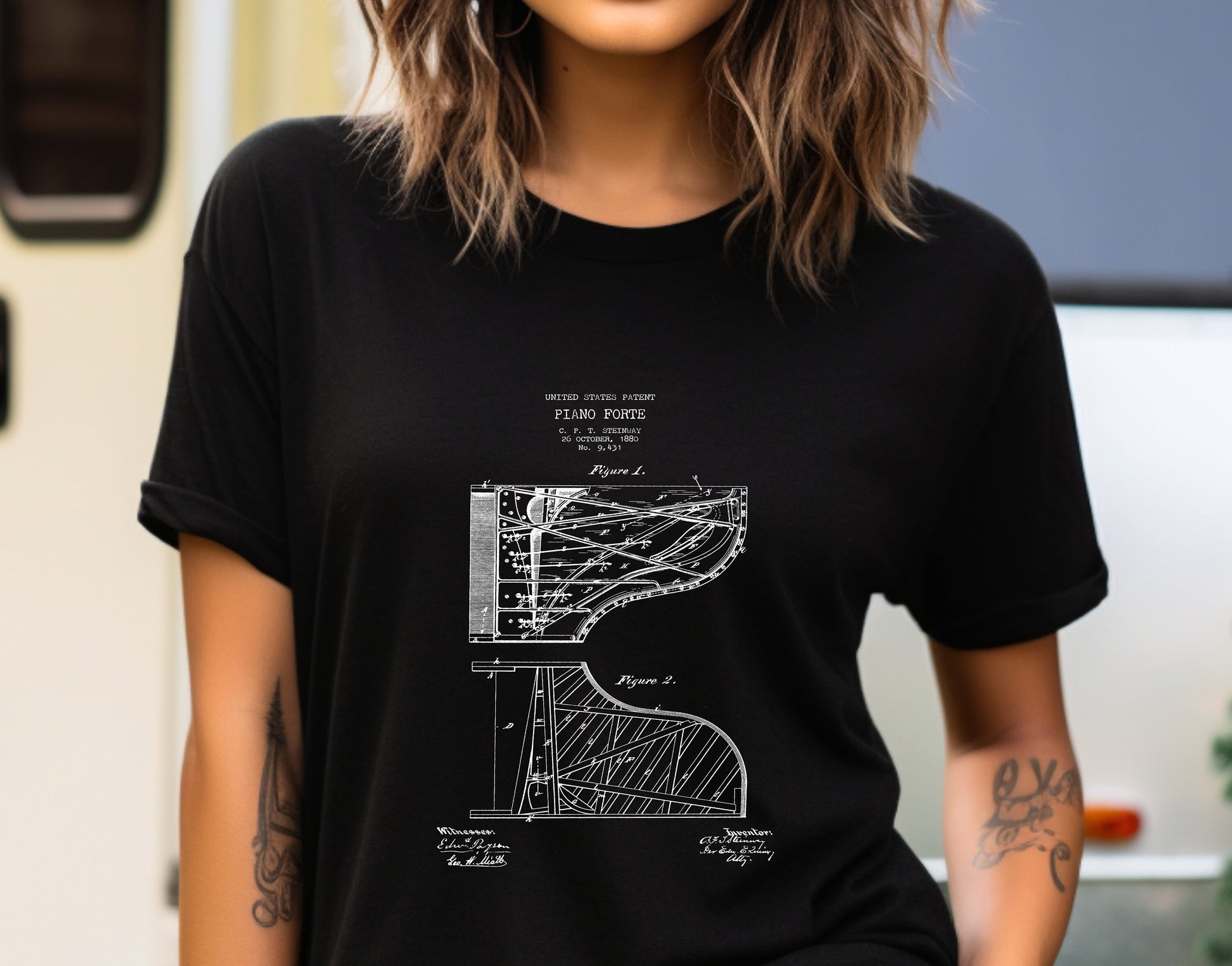 a woman wearing a black t - shirt with a drawing of a stair case