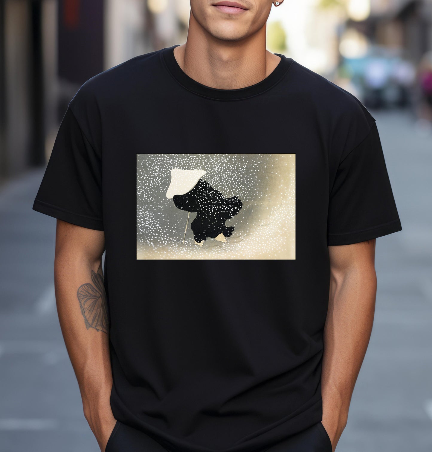 a man wearing a black t - shirt with a picture of a dog on it