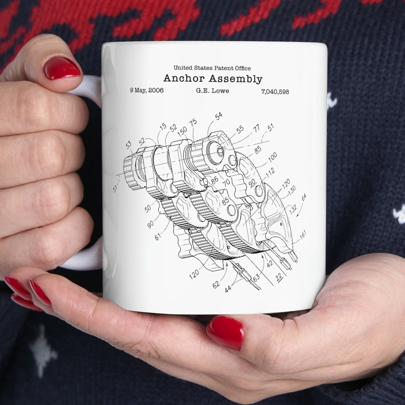 a white coffee mug with a drawing of a machine