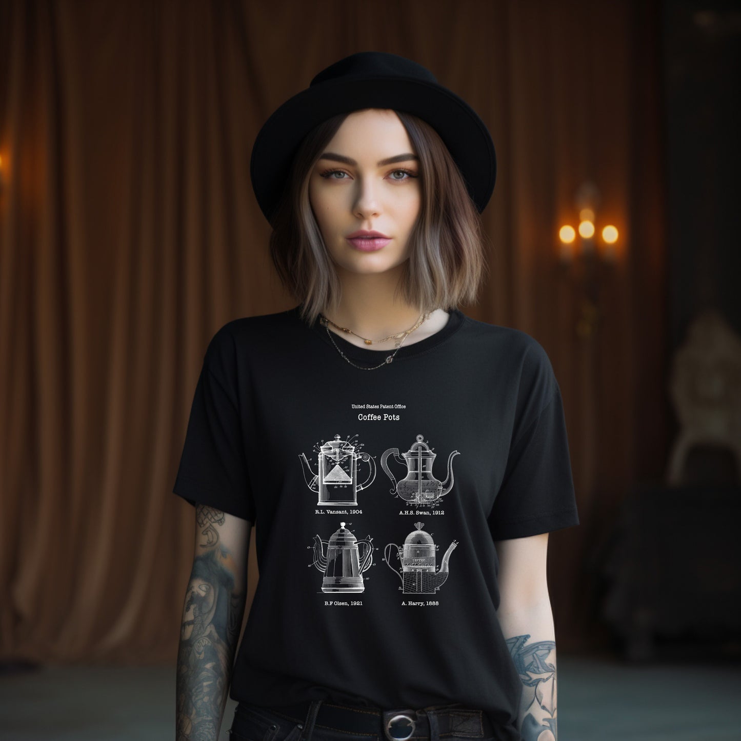 a woman wearing a black t - shirt with a teapot design on it